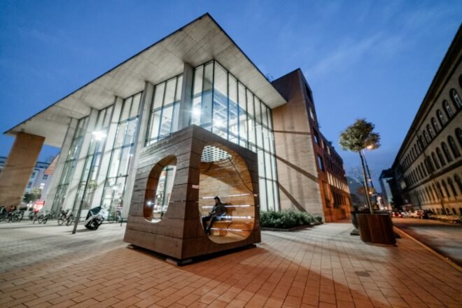large wooden cube with openings on three sides
