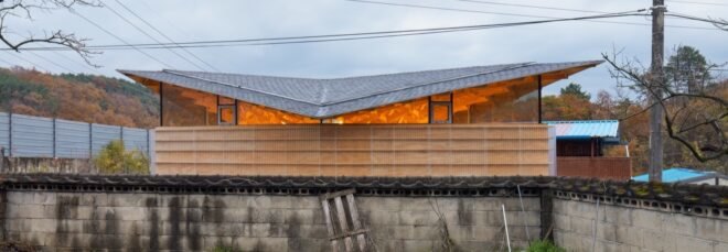 home with glowing butterfly roof
