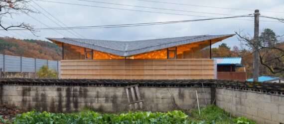 home with glowing butterfly roof