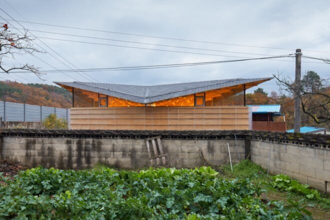 home with glowing butterfly roof