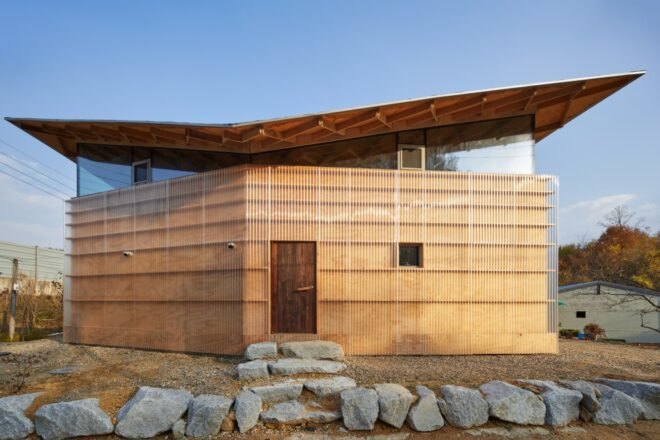 tan home with butterfly roof