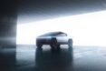 angular gray car parked in garage
