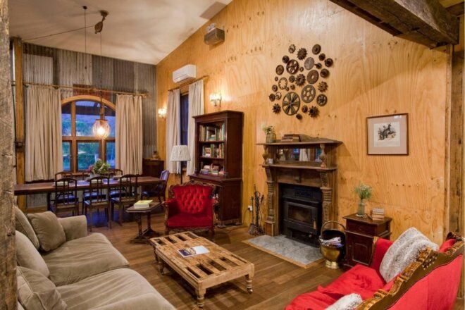 large living room with vintage furniture and a fireplace