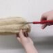 person cutting loofa