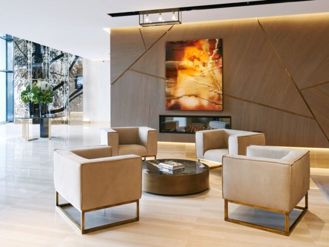hotel lobby with four tan chairs