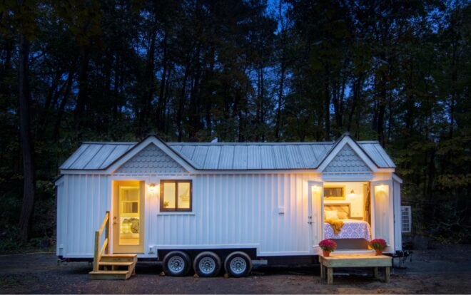white tiny farmhouse on wheels