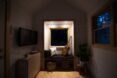 white tiny home interior with dim lights at night
