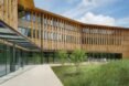 long timber building with first floor made with glass walls