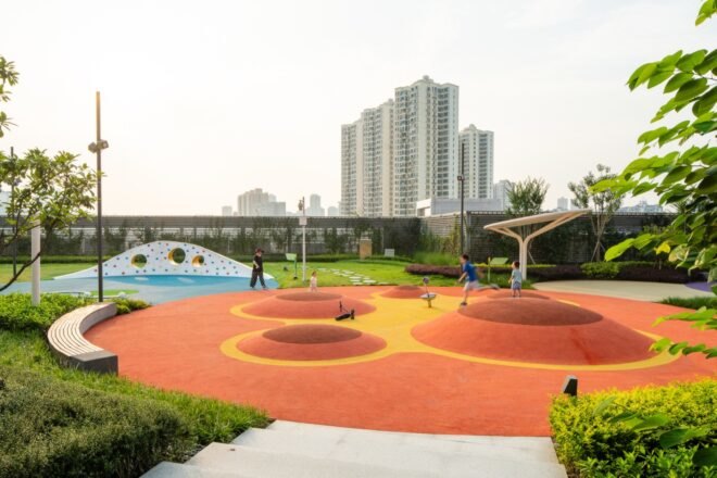 red playground area with hills