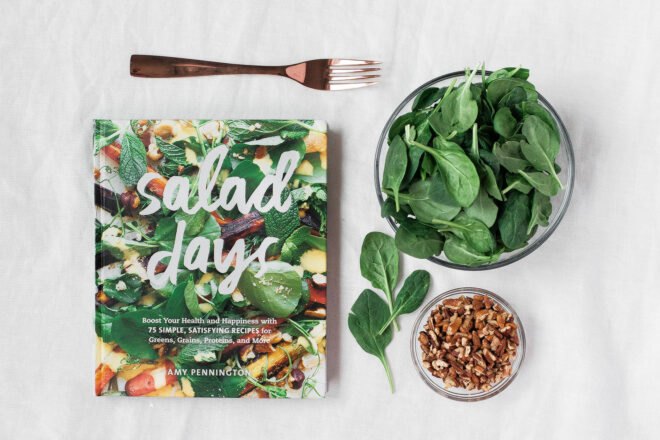 salad cookbook next to a salad