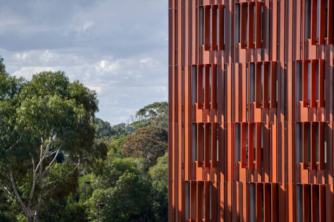 close-up of red cladding on an apartment building