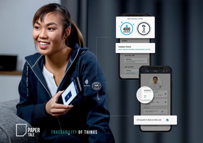 woman smiling and using phone app to scan a tag on her sweatshirt