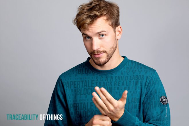 man wearing blue PaperTale shirt