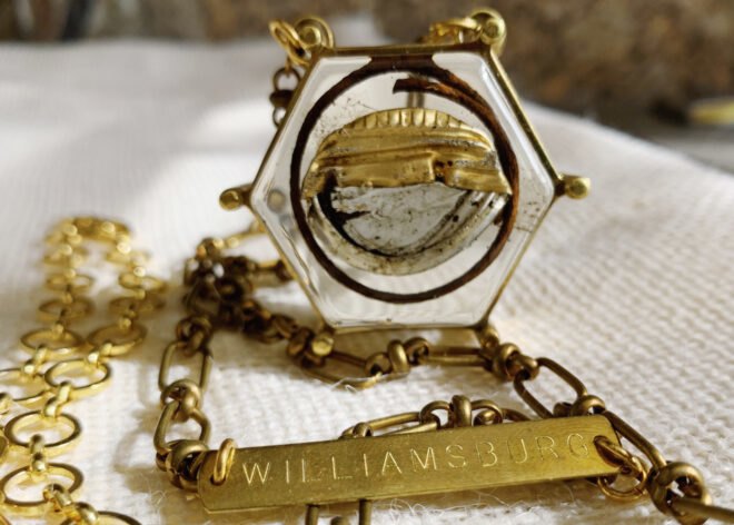 trash inside a gold necklace with tag that reads, "Williamsburg"