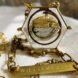 trash inside a gold necklace with tag that reads, 