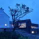 stone home on a hillside at dusk