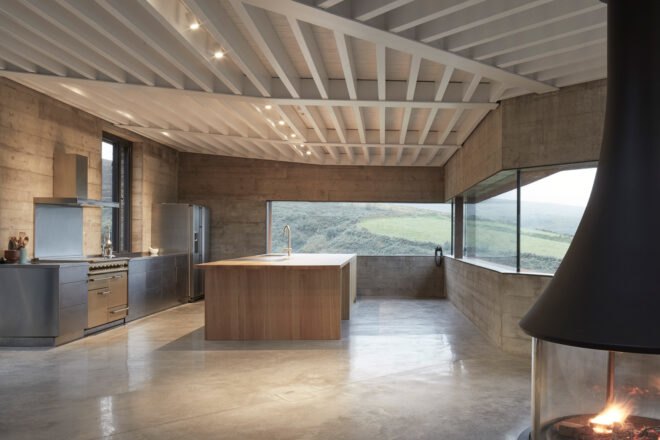 kitchen with light wood cabinets and long, narrow windows