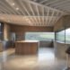 kitchen with light wood cabinets and long, narrow windows