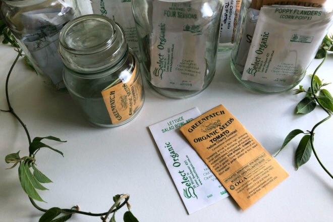 organic seed packets in glass jars