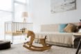 wood rocking horse inside a nursery