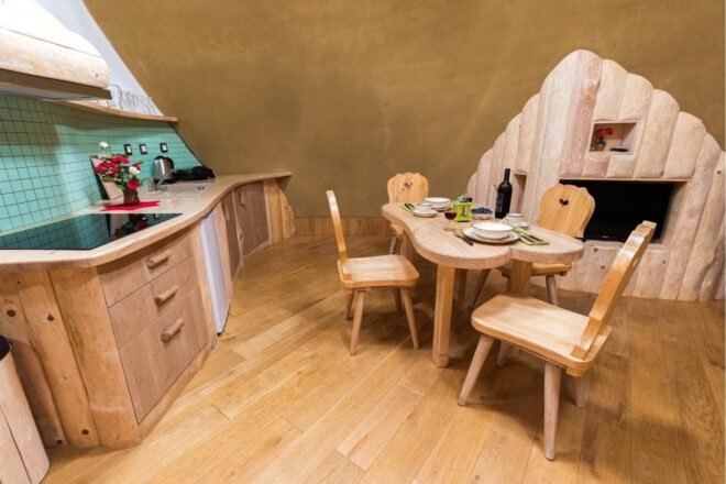 kitchen space with curved counter and dining table