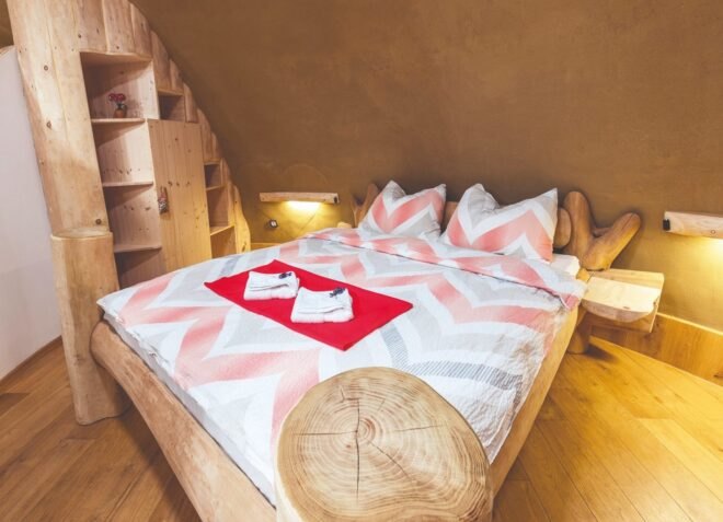 large bed in room with low ceiling