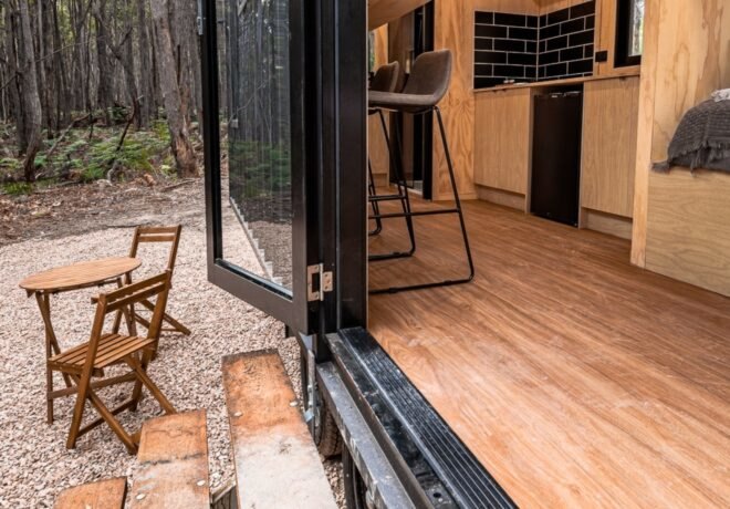 front glass door leading into tiny cabin
