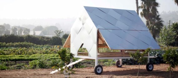 small metallic chicken coop with gabled roof