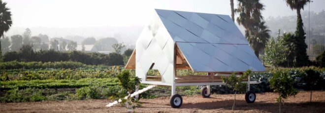 small metallic chicken coop with gabled roof