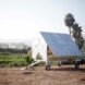 small metallic chicken coop with gabled roof