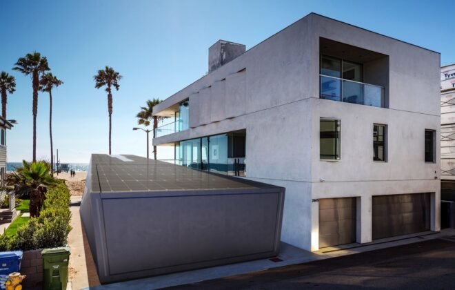 rendering of solar panels atop angular garage building next to white apartment complex near the beach