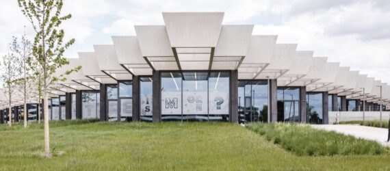 glass building with jagged roofline