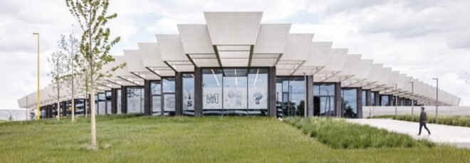 glass building with jagged roofline