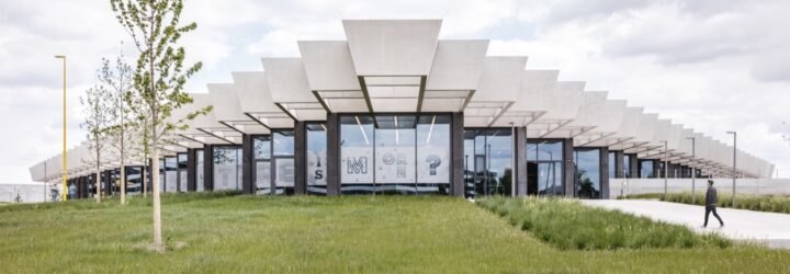 glass building with jagged roofline