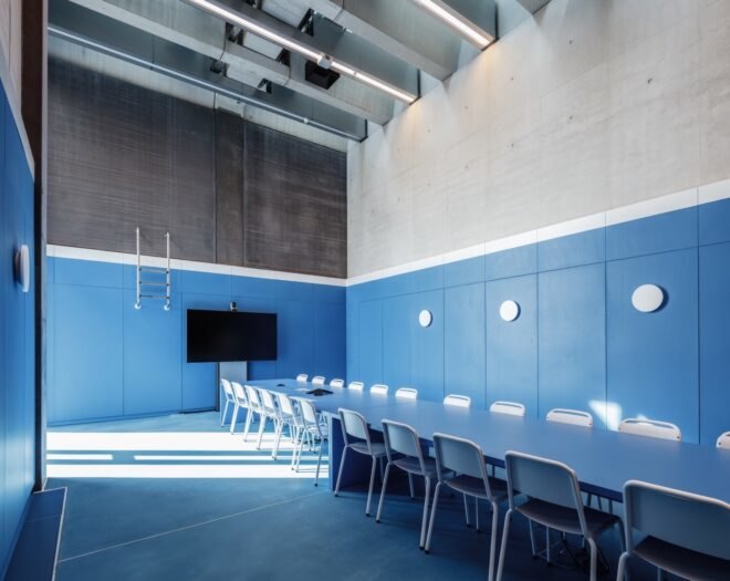 meeting room with blue walls and long rectangular table