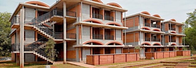 three-level brick housing complex with domed roofs