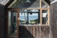 cabin with windows revealing views of the sea