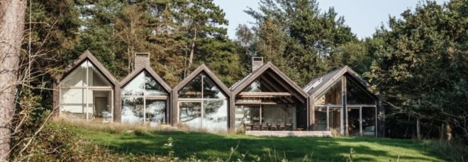 series of A-frame cabins with large windows