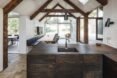 interior of cabin with kitchen with a dark wood island