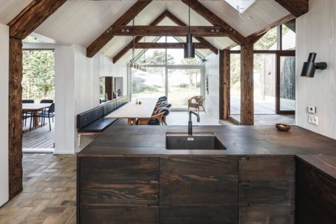 interior of cabin with kitchen with a dark wood island