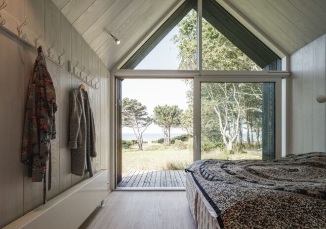 bedroom with floor-to-ceiling glass facade