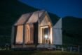 timber-framed cabin with clear walls