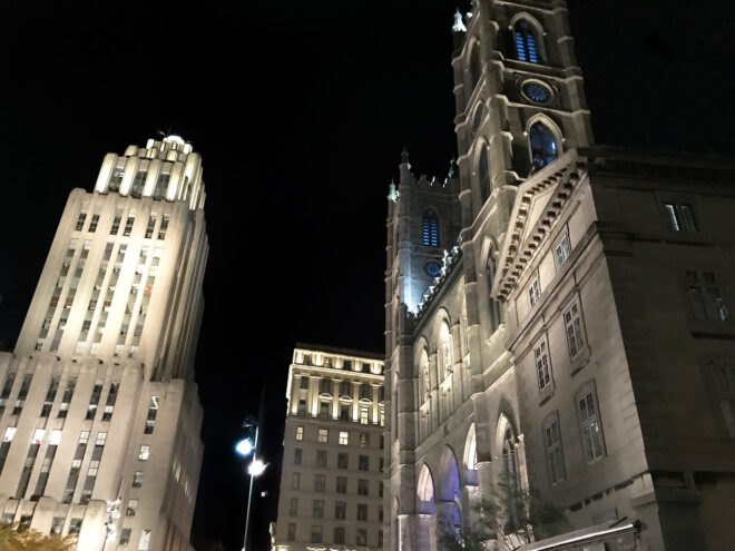 three skyscrapers against a night sky