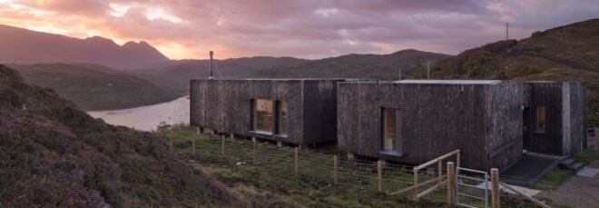 elongated timber home looking out over landscape