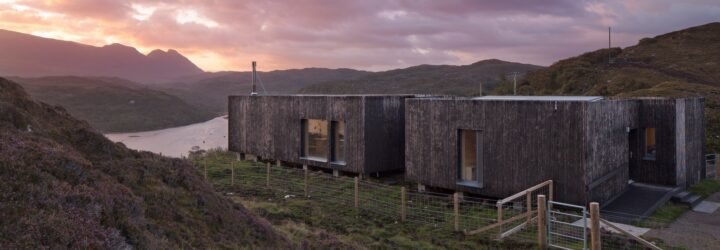 elongated timber home looking out over landscape