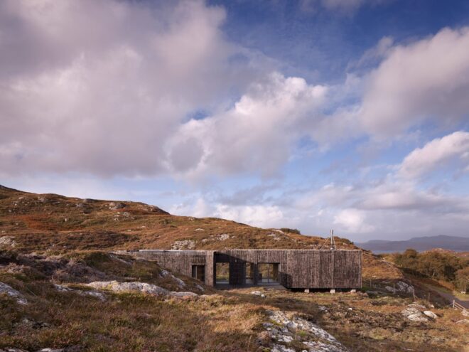 elongated timber home looking out over landscape