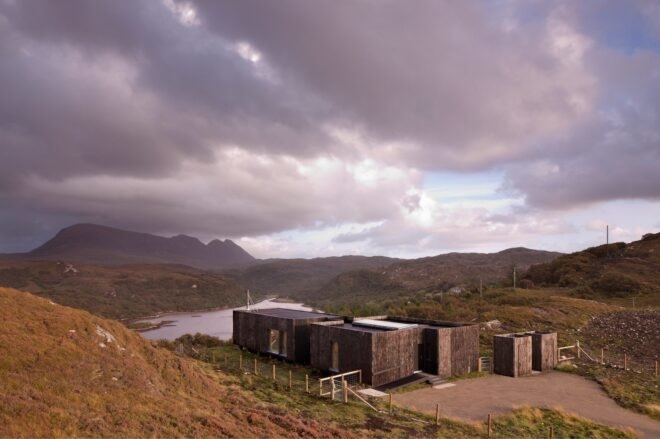 elongated timber home looking out over landscape
