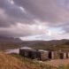 elongated timber home looking out over landscape