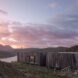 elongated timber home looking out over landscape