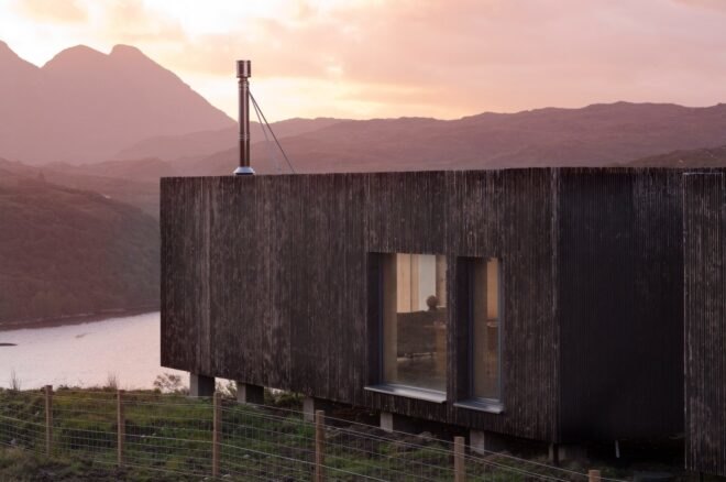 elongated timber home looking out over landscape